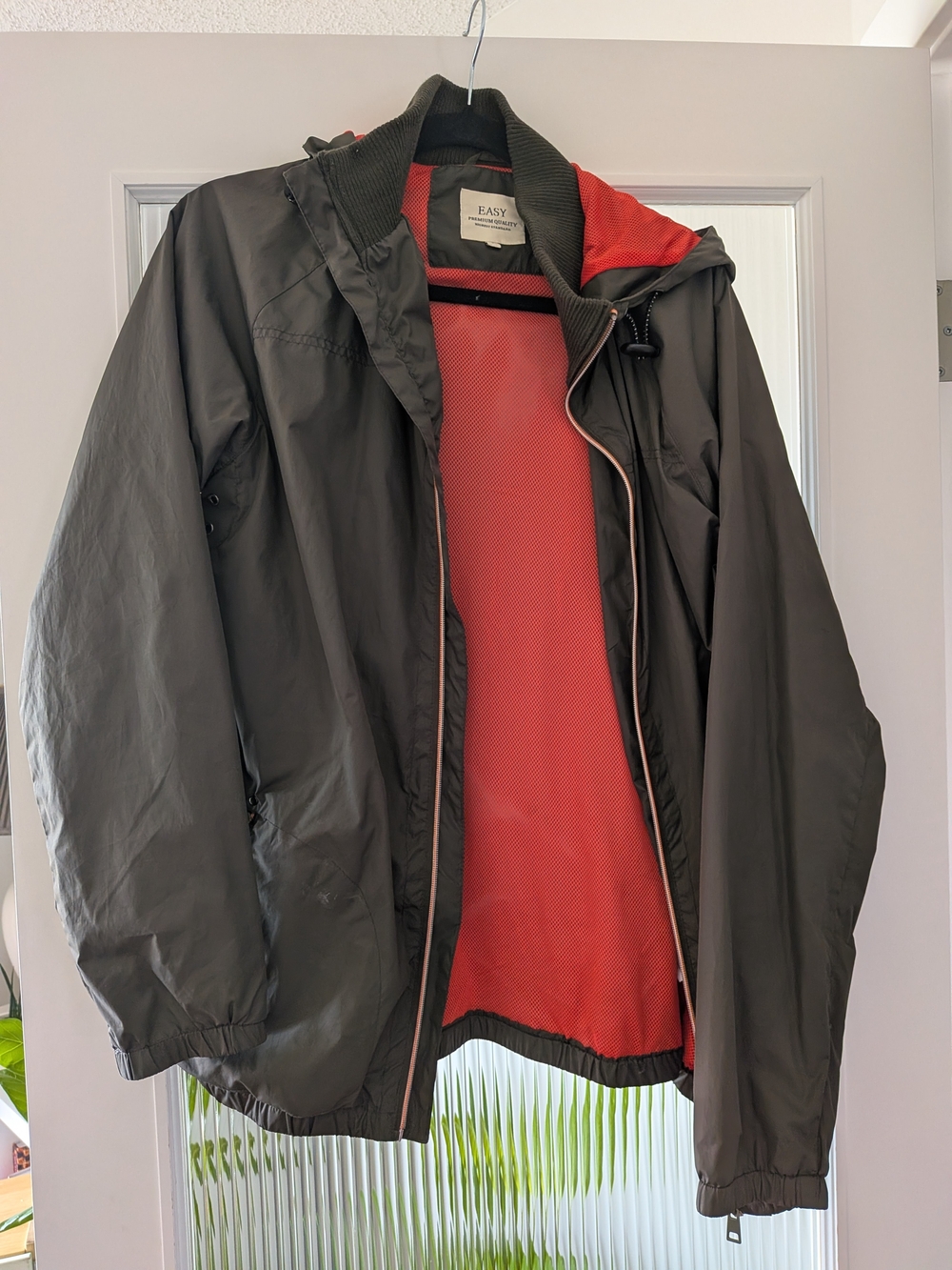Hooded Windbreaker Jacket in dark Green with Orange Lining